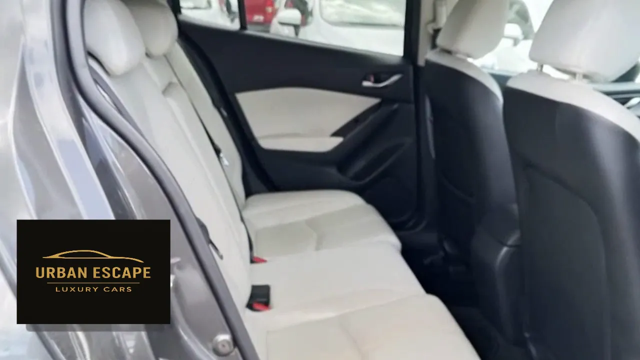 Mazda Axela back seats in cream, seen through the open rear door