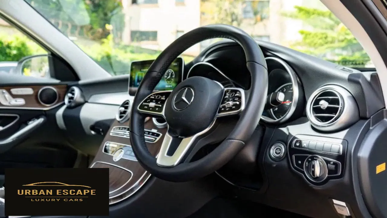 Mercedes-Benz C 200 steering wheel with control buttons, instrument dials and wood trim, right-hand drive