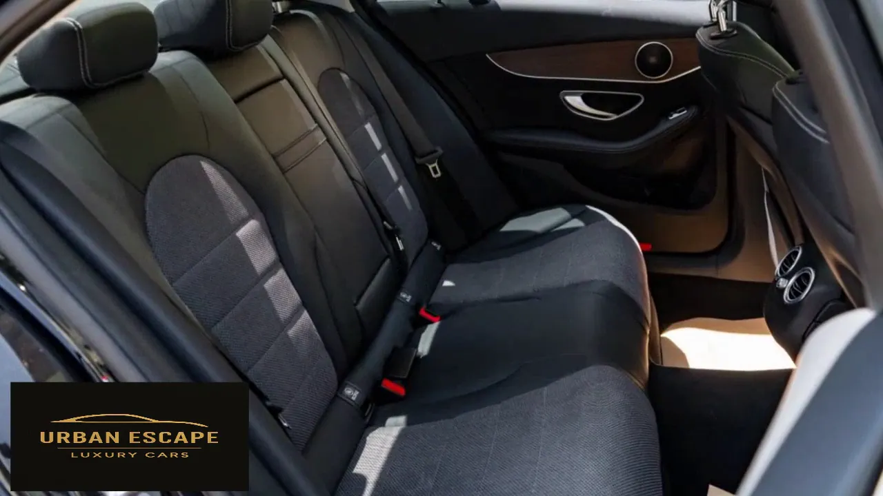 Mercedes-Benz C 200 back seats in black with grey fabric inserts, rear air vents and wood door trim