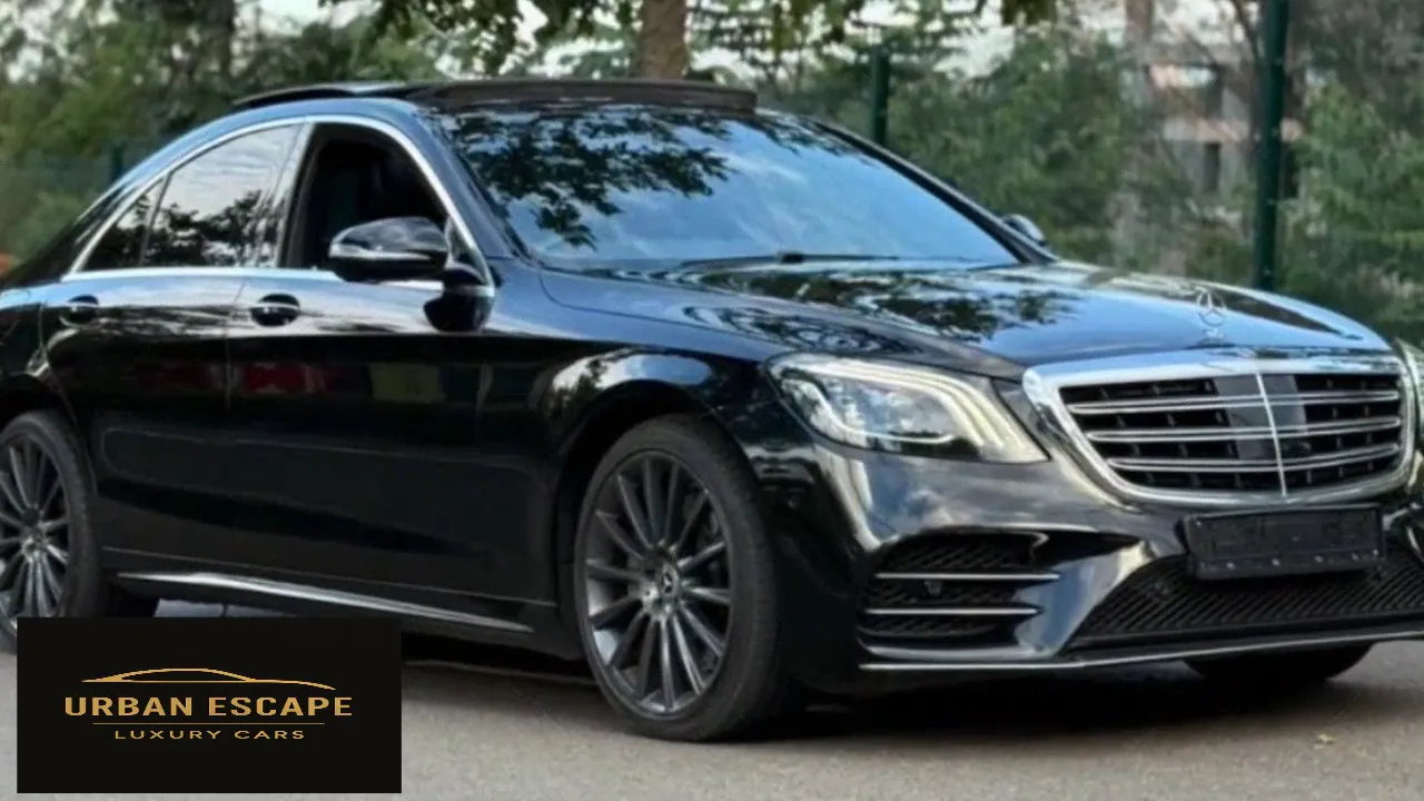 Mercedes-Benz S 350 in black, front three-quarter view with chrome grille and dark multi-spoke alloy wheels