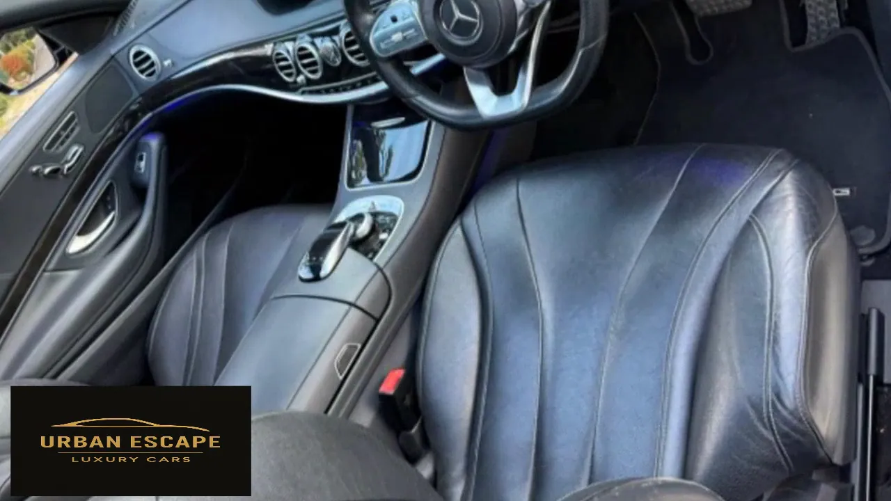 Mercedes-Benz S 350 black leather front seats, steering wheel and centre console with blue ambient lighting