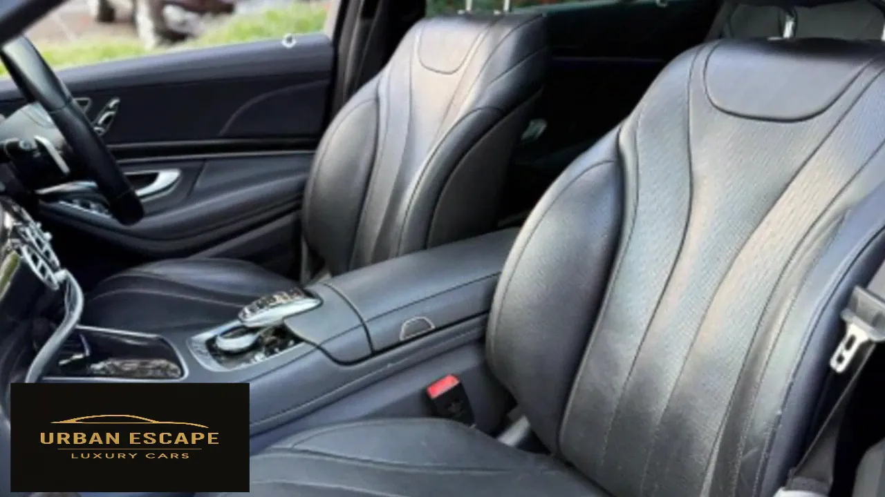 Mercedes-Benz S 350 black leather front seats with centre armrest and chrome console controller