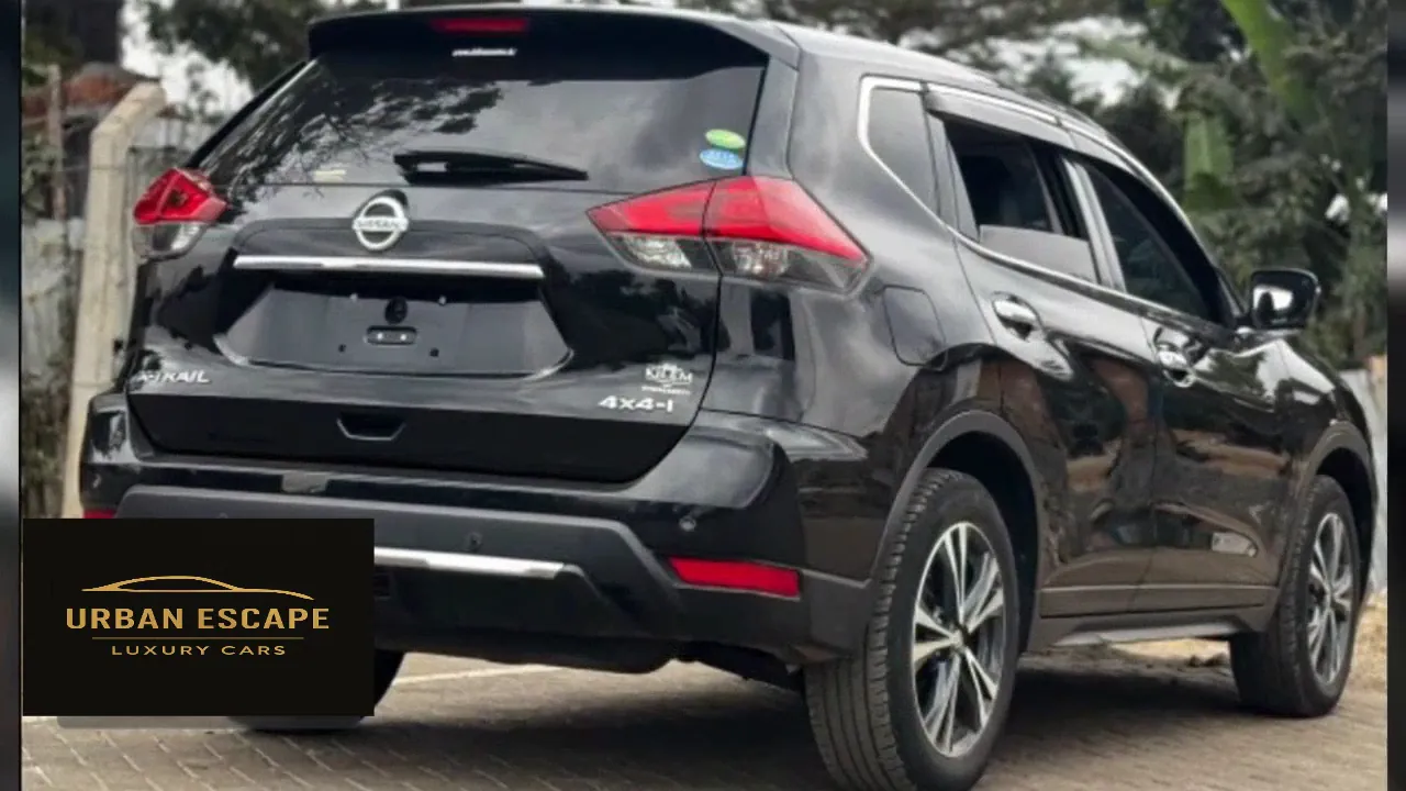 Nissan X-Trail in black, rear and right side view with 4x4-i badge and alloy wheels