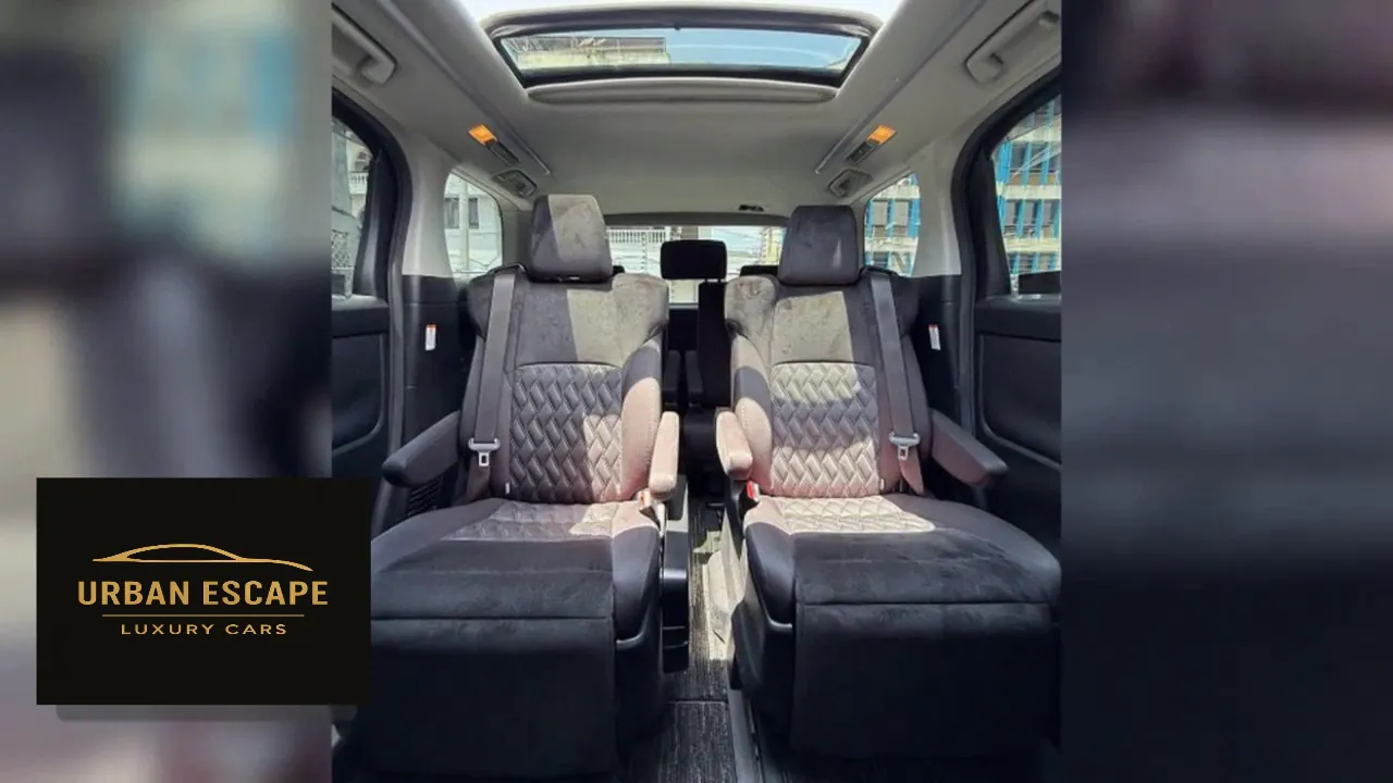 Toyota Alphard black second-row captain seats with quilted backs, armrests and a sunroof above