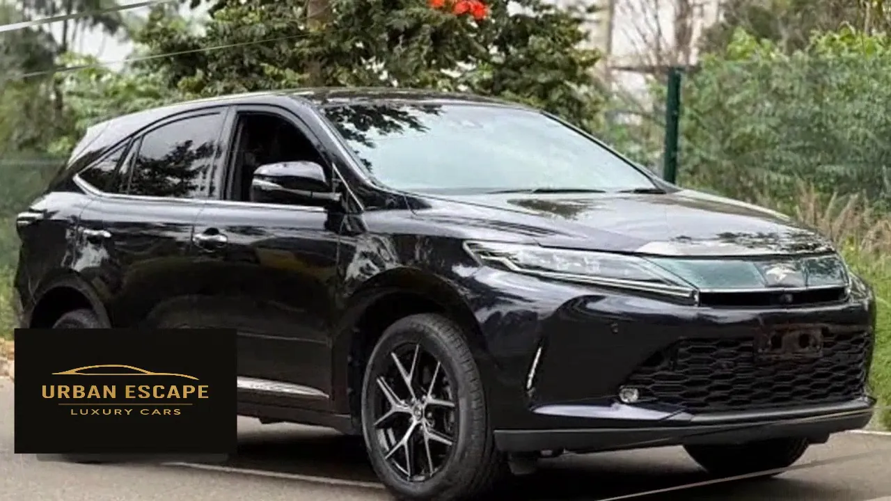 Toyota Harrier in black, front three-quarter view with slim headlights, mesh grille and two-tone alloy wheels
