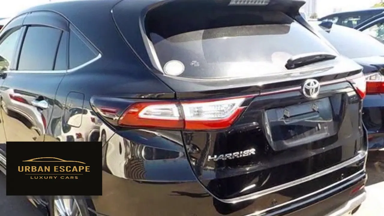 Toyota Harrier in black, close rear three-quarter view with tail light, Toyota badge and Harrier lettering