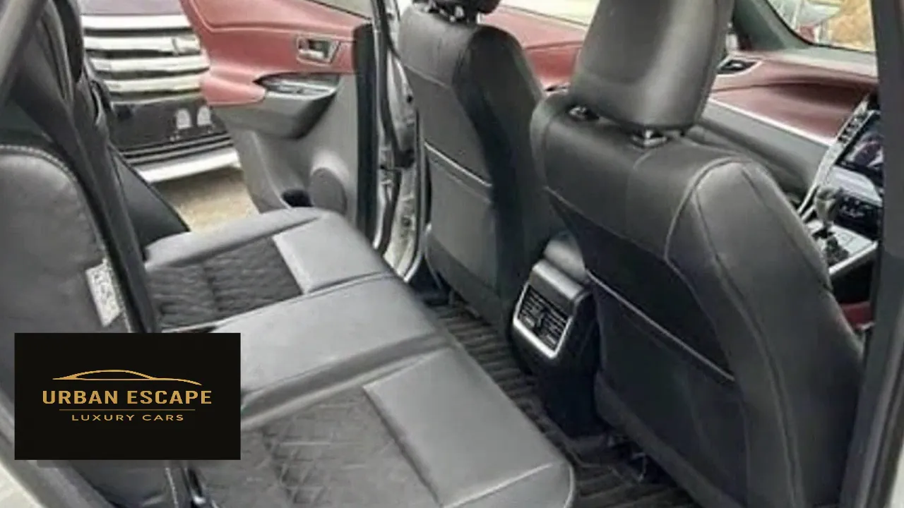 Toyota Harrier back seat with quilted inserts, showing legroom, rear air vents and burgundy door trim