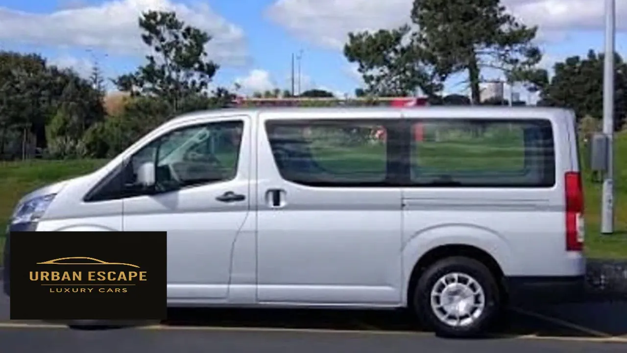 Toyota Hiace in silver, full side view with sliding door and large side windows