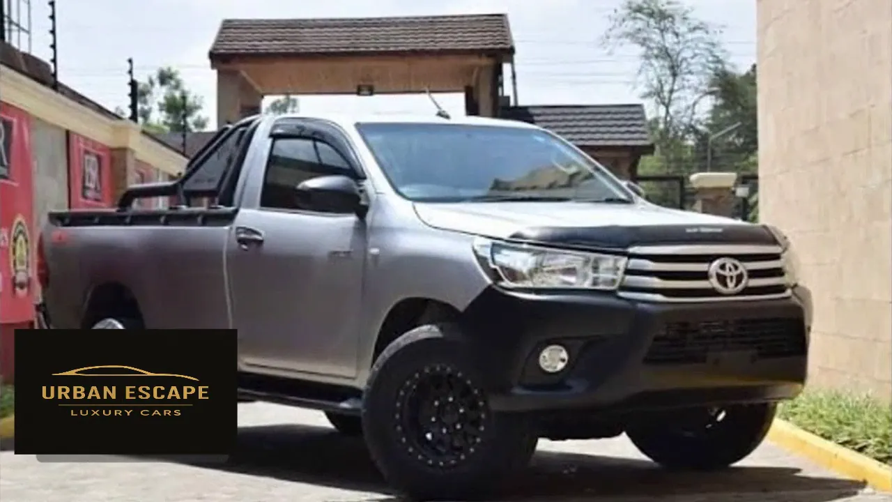 Toyota Hilux Single Cab in silver, front three-quarter view with black wheels, bonnet guard and roll bar