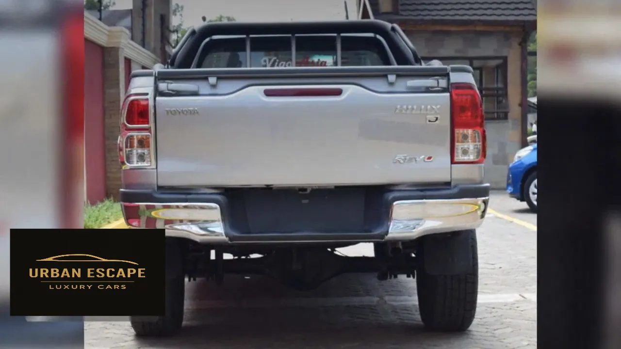 Toyota Hilux Single Cab in silver, straight rear view with Toyota, Hilux and Revo badges and chrome bumper ends
