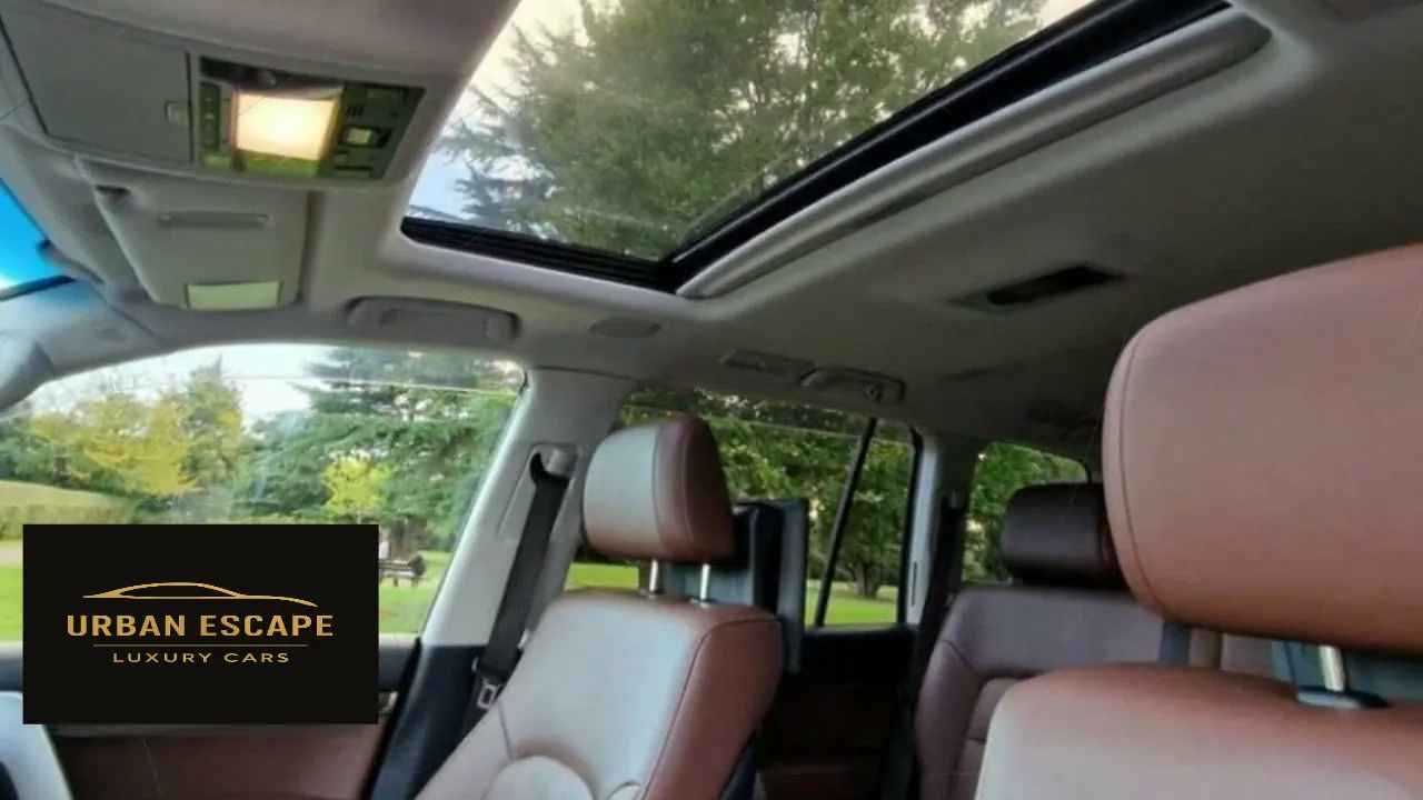 Toyota Land Cruiser V8 interior with sunroof, roof lights and brown leather seats