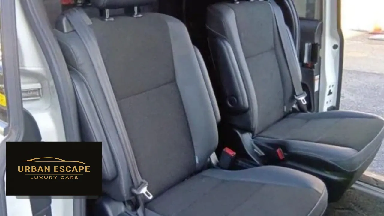 Toyota Noah second row with two separate dark grey fabric seats, armrest and seat belts