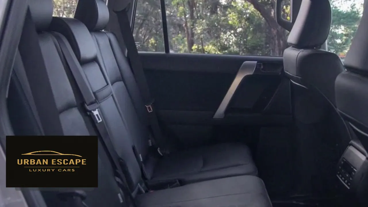 Toyota Land Cruiser Prado back seats in black leather with headrests and seat belts